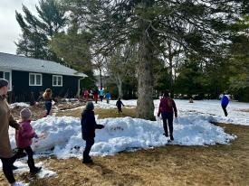 Children flood outside and across mounds of snow