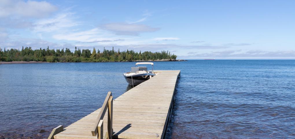 dock stretching out into the lake, inviting visitors to come on in