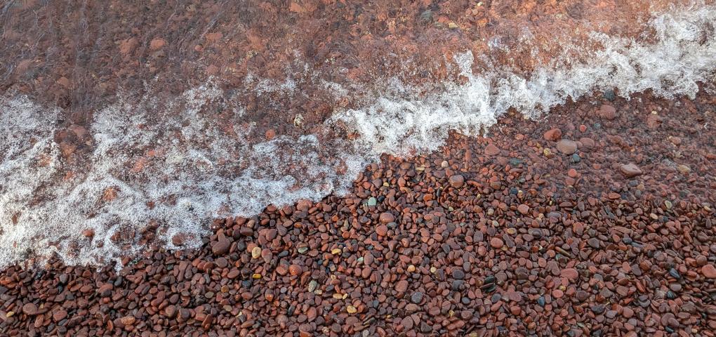 wave washing over beautiful rock beach
